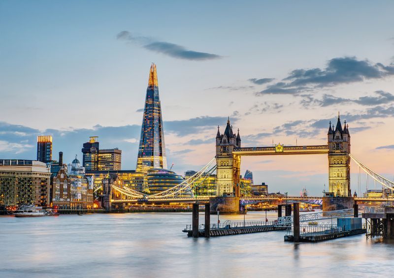 The Tower Bridge in London after sunset with the Shard in the ba