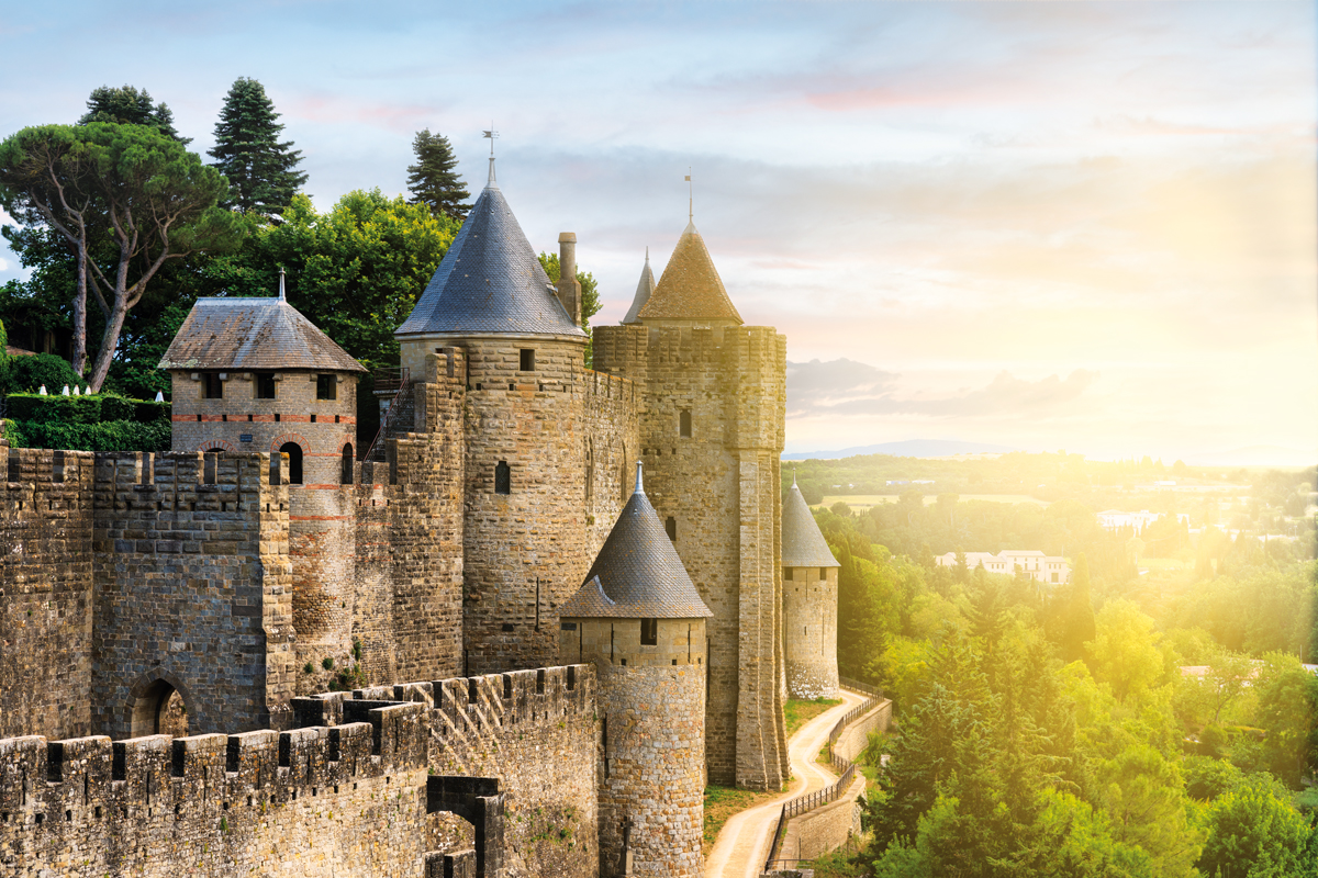 view of the walled city (La Cité) of Carcassonne in France - sunset sky